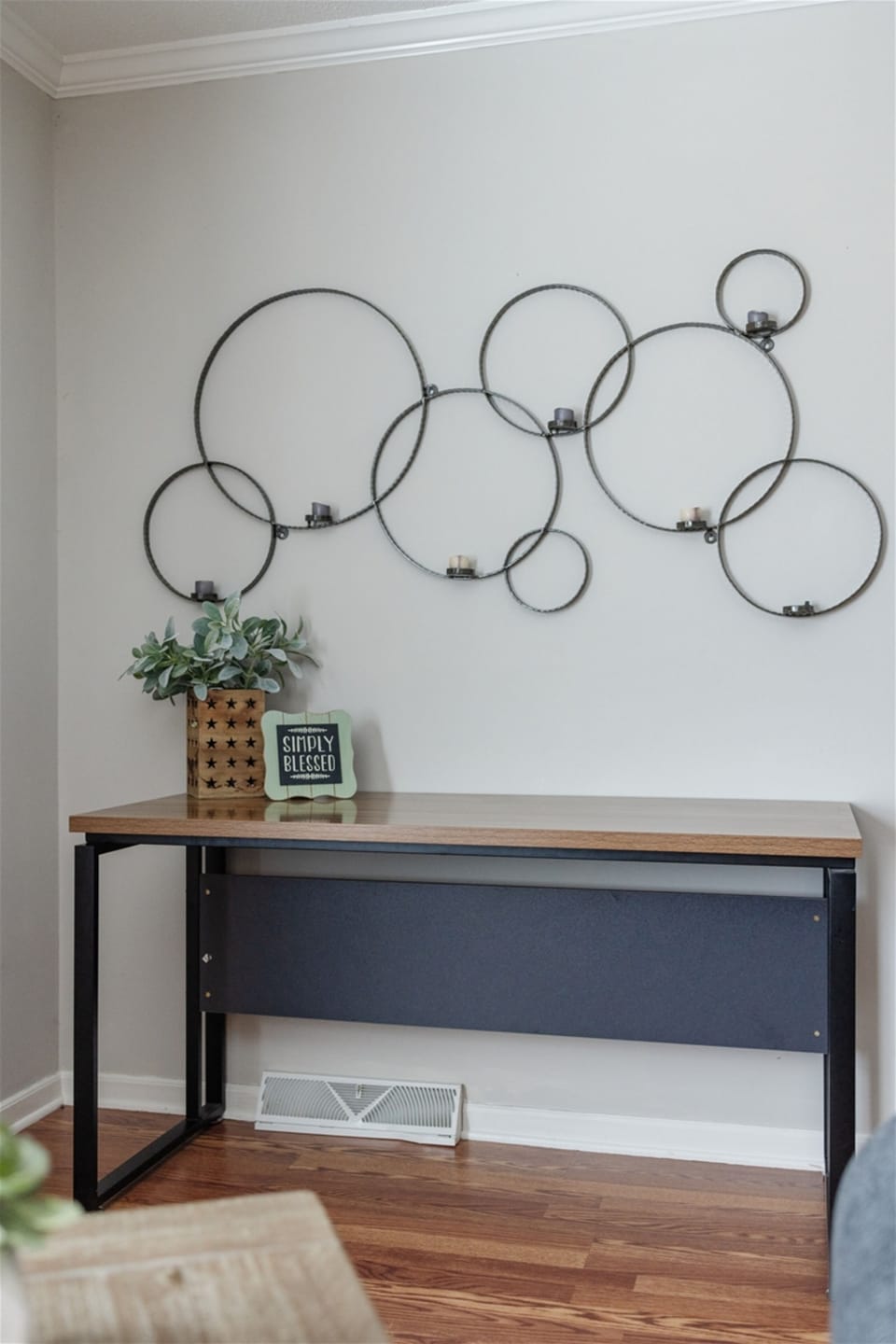 Work space, large desk that is located in the living room.