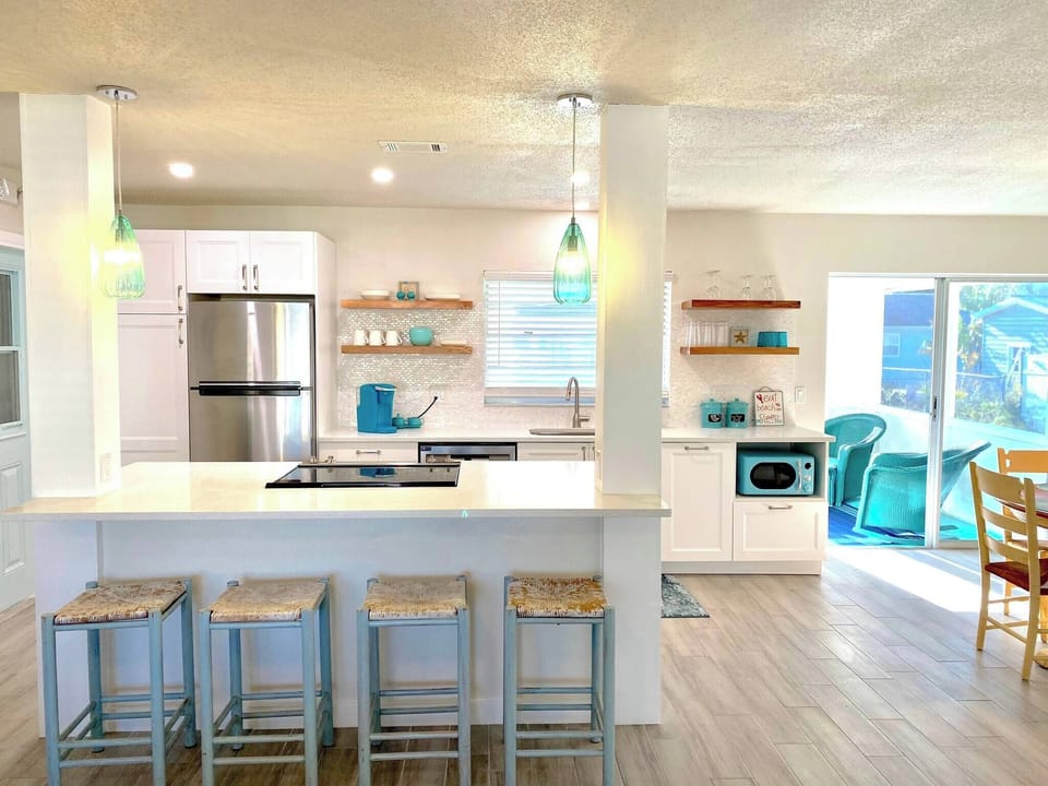 You can hang out at the island and watch the cook cook! Or, pick at the food as a taster. You know, make sure it gets done right of course. The fully stocked kitchen has everything you need to make delicious meals.