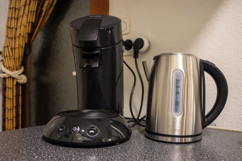 Coffee maker and hot water kettle for enjoying your morning coffee or tea.