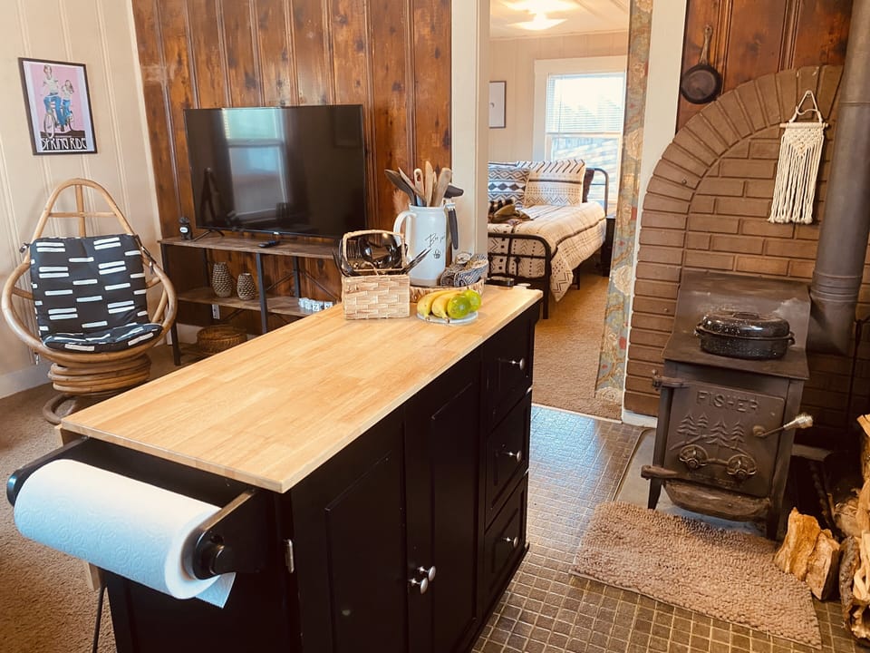 The island creates more counter & cupboard space