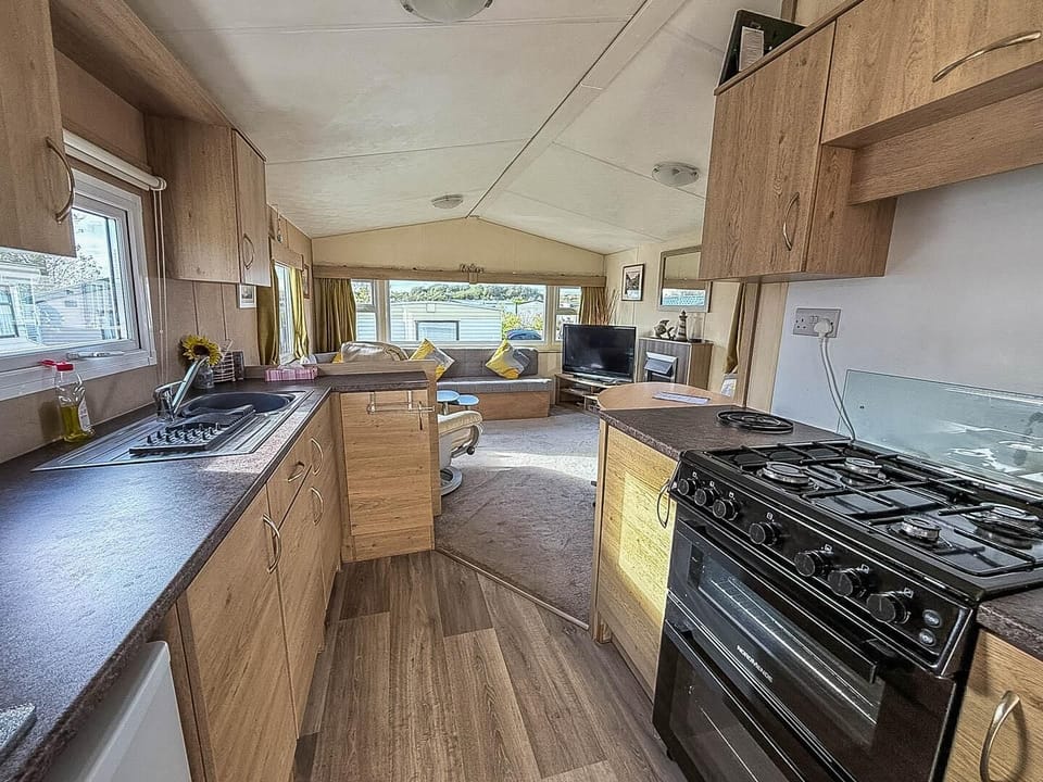 Bright, open kitchen flowing into cozy living area for gatherings
