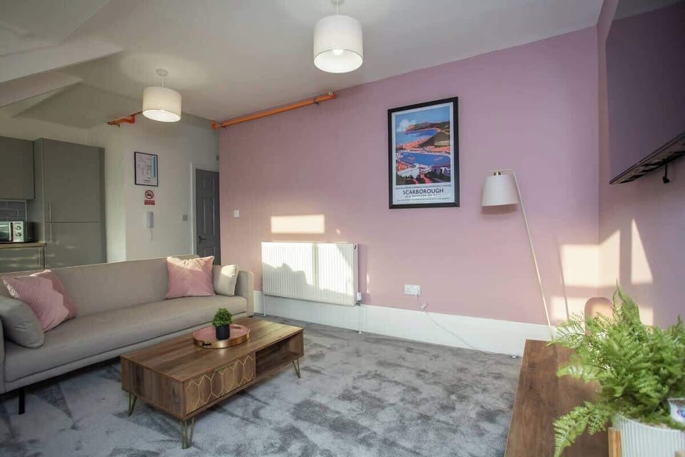 Step into your tranquil haven in the spacious living area, where coastal elegance meets modern comfort.