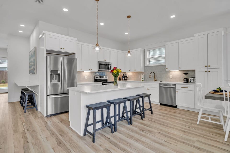 Kitchen Island with Additional Counter Seating Down the Hall