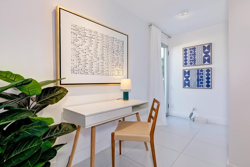 Retreat to our spacious second ensuite bedroom featuring a luxurious king bed, sitting area and dedicated work desk.  This inviting space ensures comfort, style and productivity for your perfect getaway!