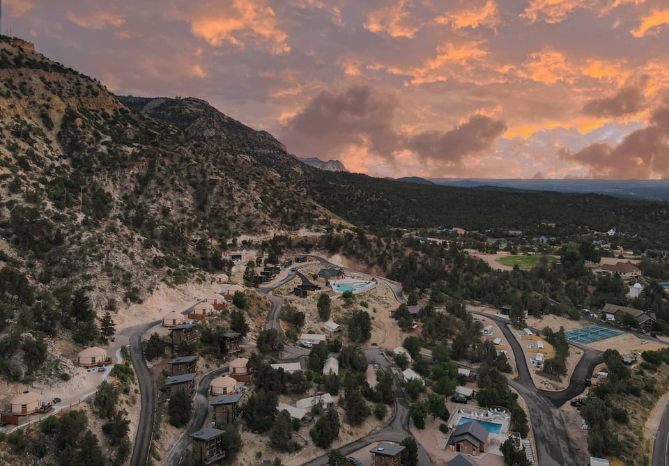 Aerial sunset view of East Zion Resort, featuring unique stays, resort amenities, and beautiful scenery near Zion National Park and Bryce Canyon.