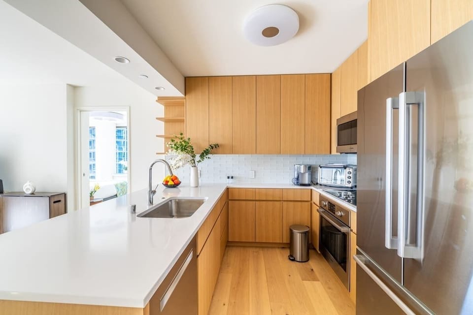 Enjoy an aesthetically pleasing kitchen. The tastefully designed space combines modern elegance with a harmonious area.