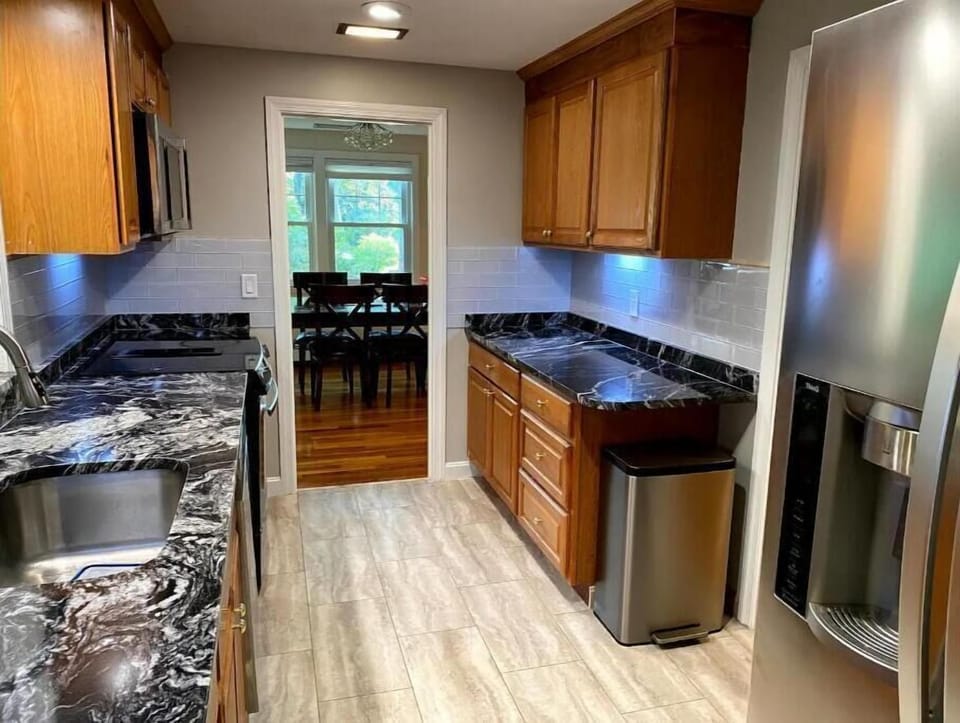 There is a fully furnished full kitchen with granite countertops.
