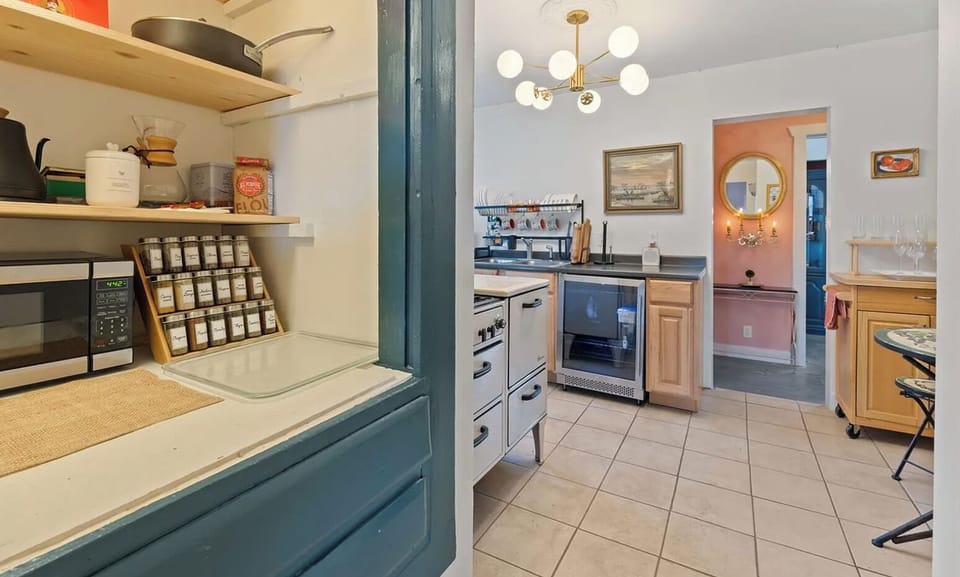 A classic telephone nook now holds coffee, tea, and all the spices you need