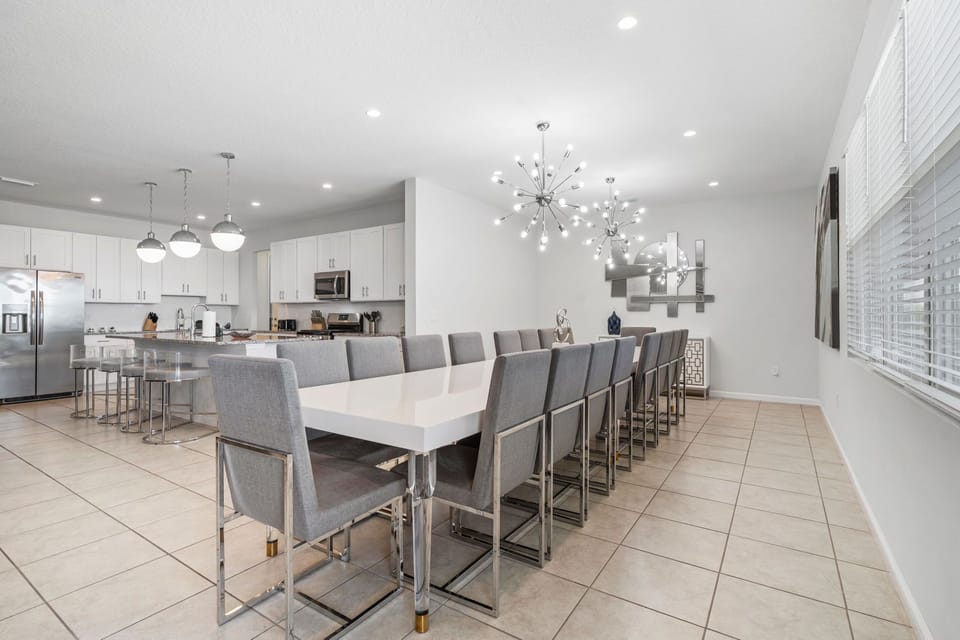 Modern kitchen featuring elegant cabinetry, pendant lighting, and open-concept flow.