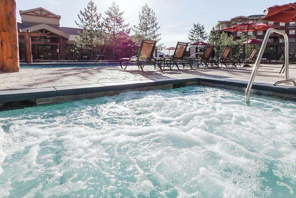 Hot tub by indoor/outdoor pool