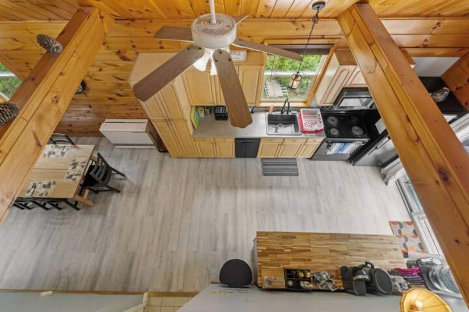 View from 3rd floor loft down to dining room and kitchen