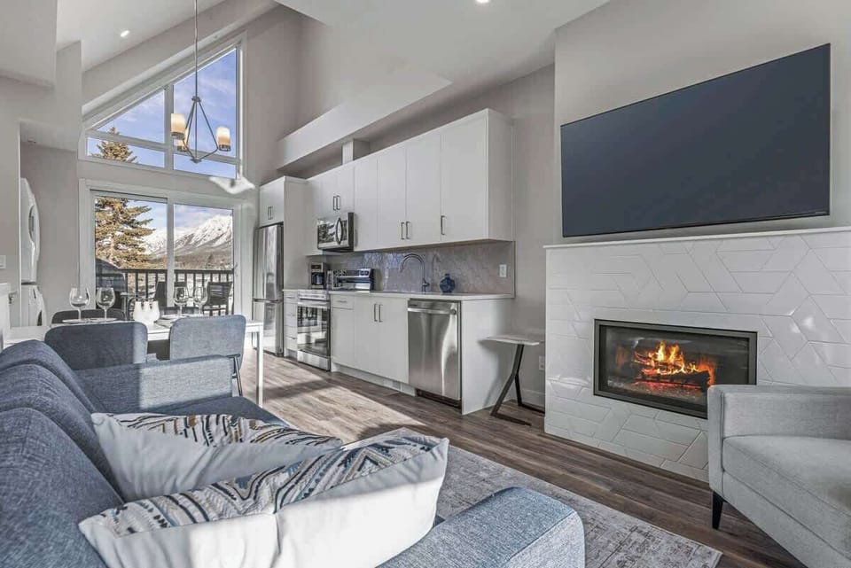 Open layout Living/Dining/Kitchen adjacent to Balcony with Natural BBQ and Mountain view of Lady Macdonald.