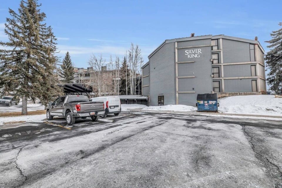 An exterior view of the Silver King building and the parking.