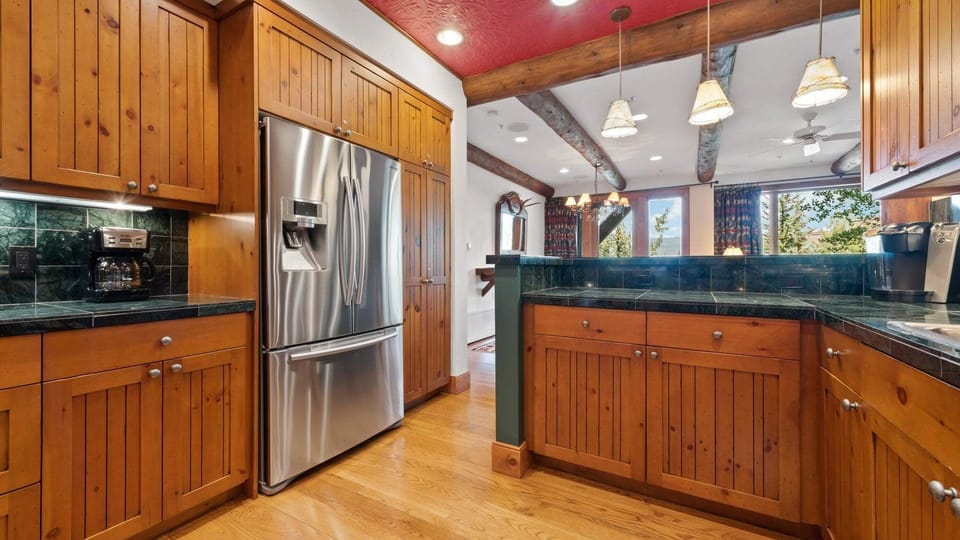 Kitchen, Main Level - With stainless steel refrigerator and island