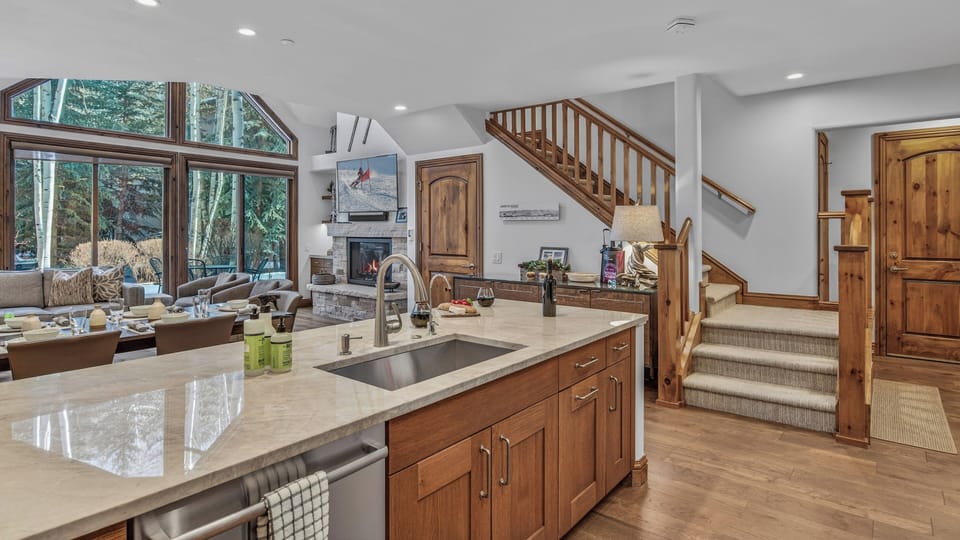 Kitchen, Main Level - Island with bar seating and staircase view