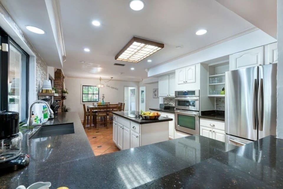 Unleash your culinary skills in our sleek chef's kitchen.