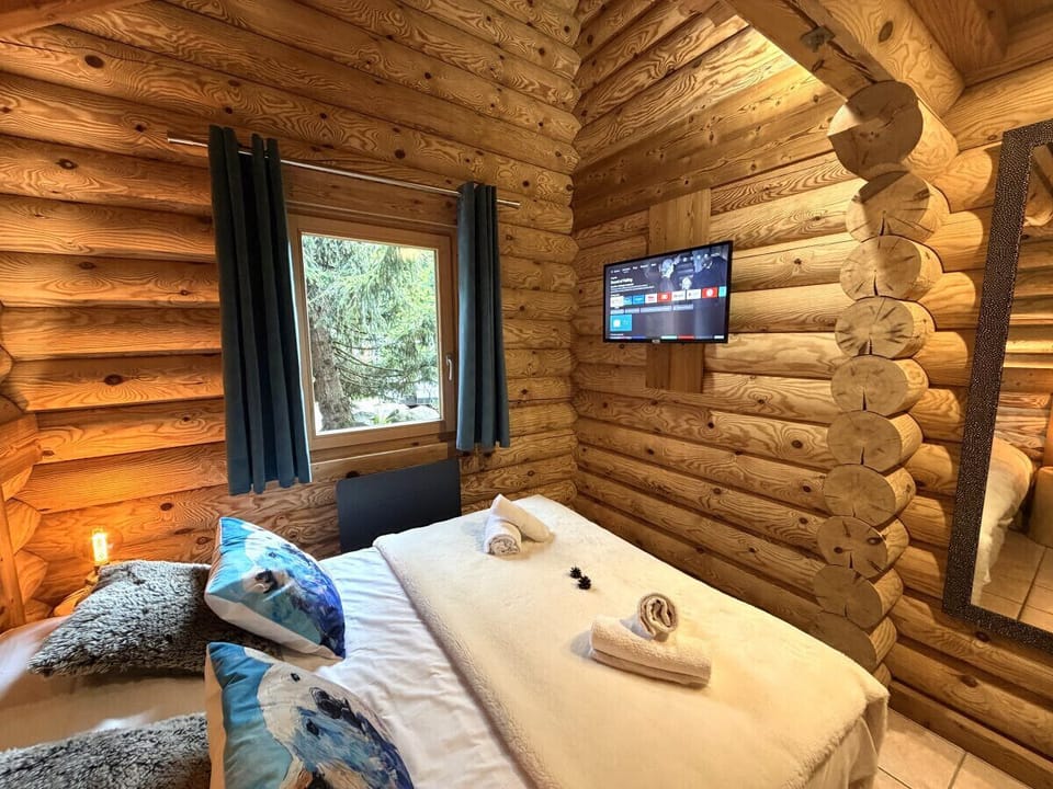 Bedroom with double bed and TV