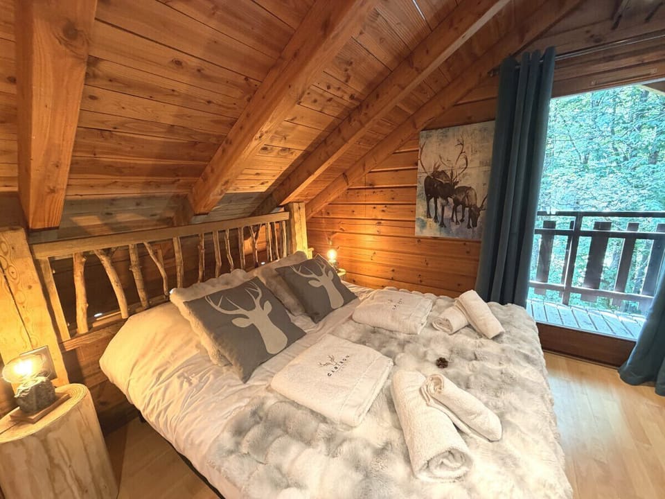 Bedroom with double bed and TV