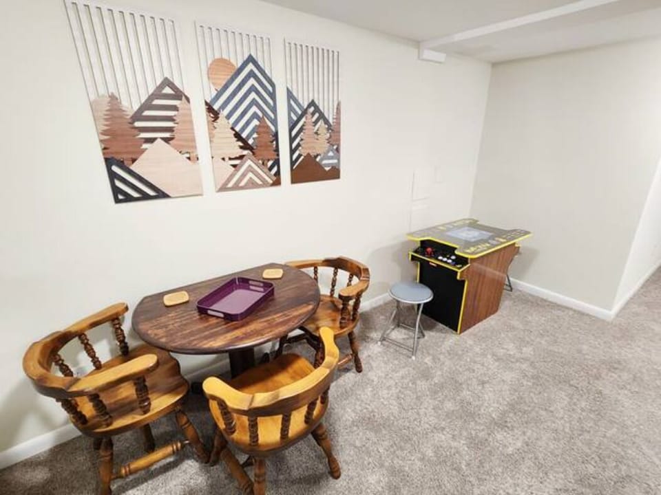 lower living room table/chairs and vintage Pac Man arcade game 