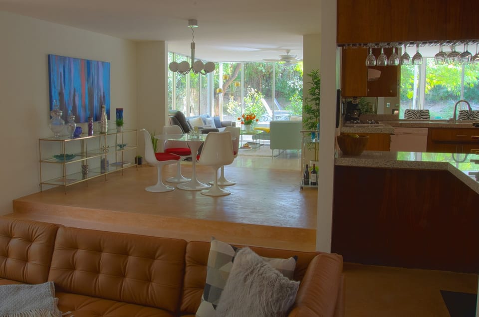 Mod dining room and sunken living room with bar