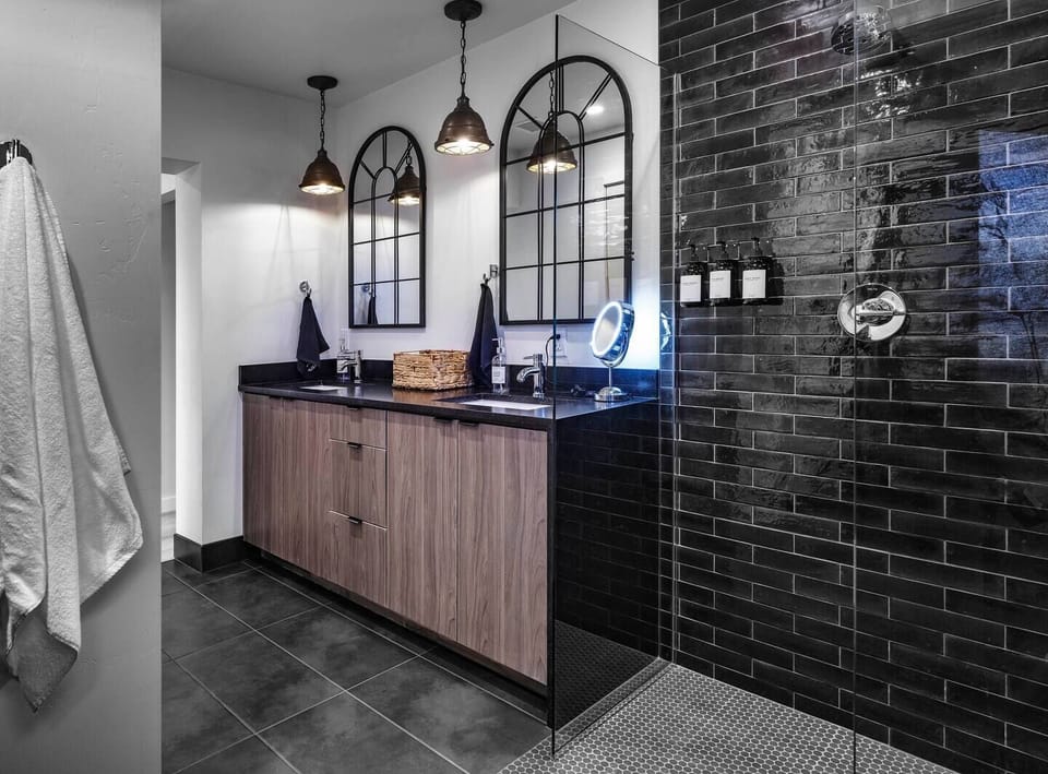 Step from the master bath's spacious shower into bliss with outdoor access to your private cedar hot tub. Luxury meets convenience at Pitchner Place.
