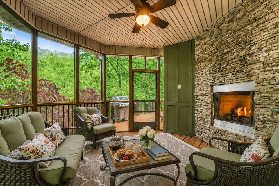 Outdoor fireplace in screened-in room off master bedroom