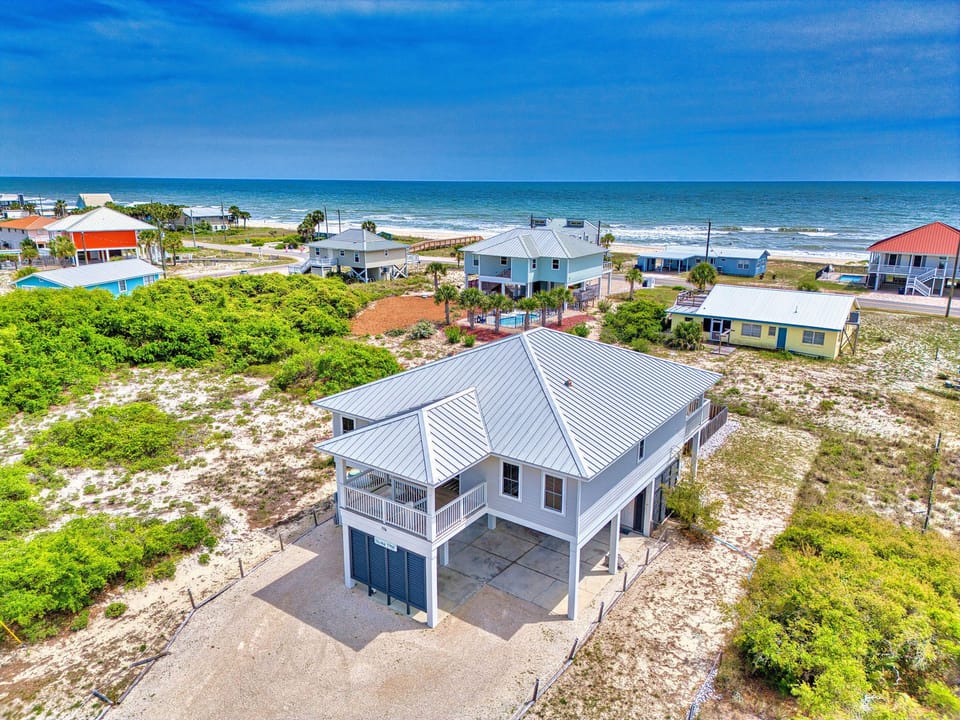 Another aerial view of the house with Gulf in background.