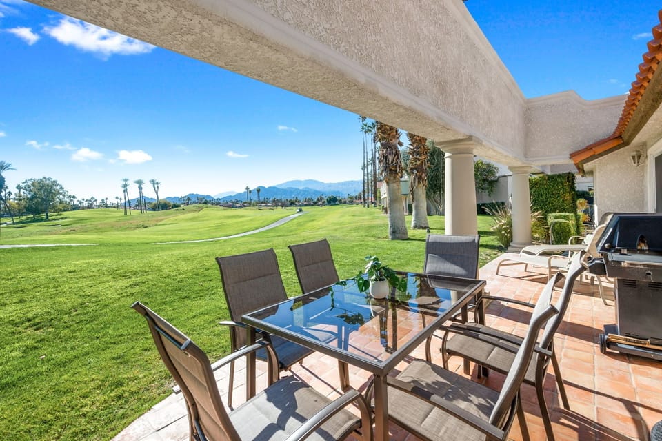 Patio table, 2 lounge chairs and BBQ to enjoy your backyard oasis. 