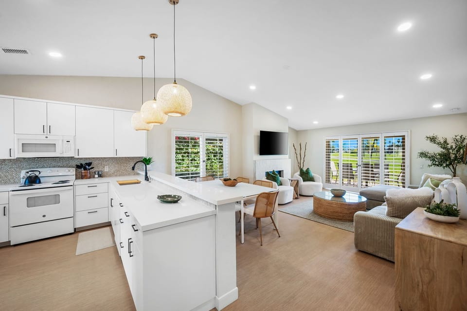 The open-concept kitchen, dining, & living area designed for ideal entertaining!