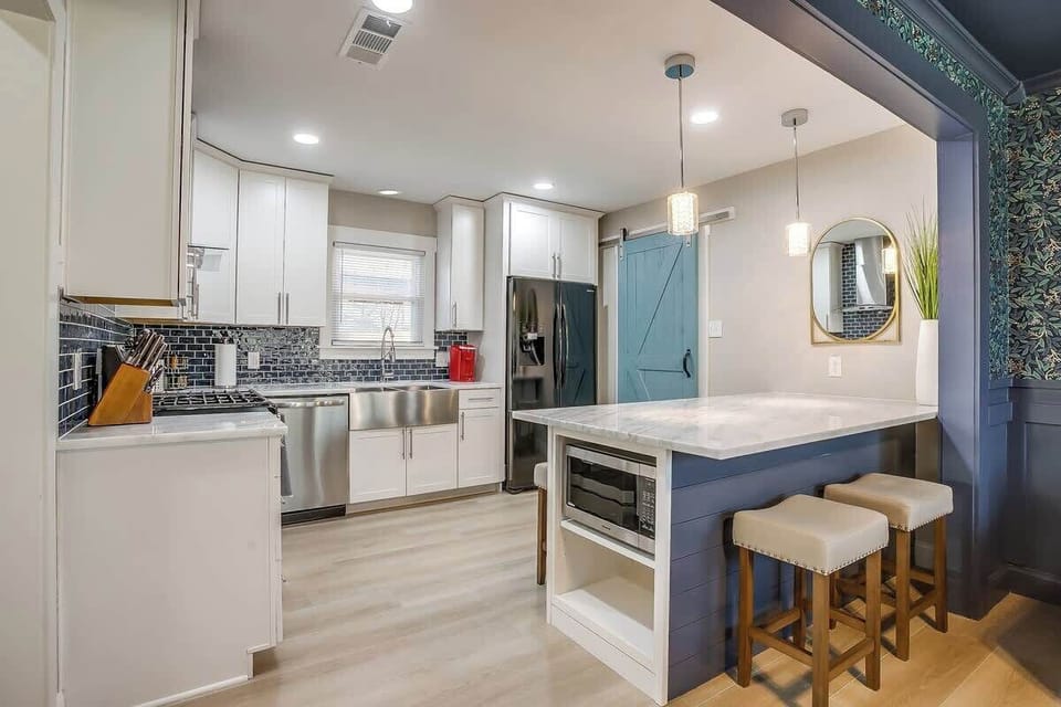 Sip your morning coffee at the cozy breakfast bar or gather for evening cocktails. This inviting kitchen is perfect for cooking together, sharing laughs & making lasting memories with loved ones in a beautifully designed space.