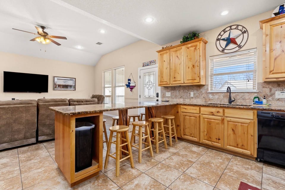 Seamlessly transition into the heart of the home as you walk into the kitchen, open to the living room, creating a welcoming and inclusive space.