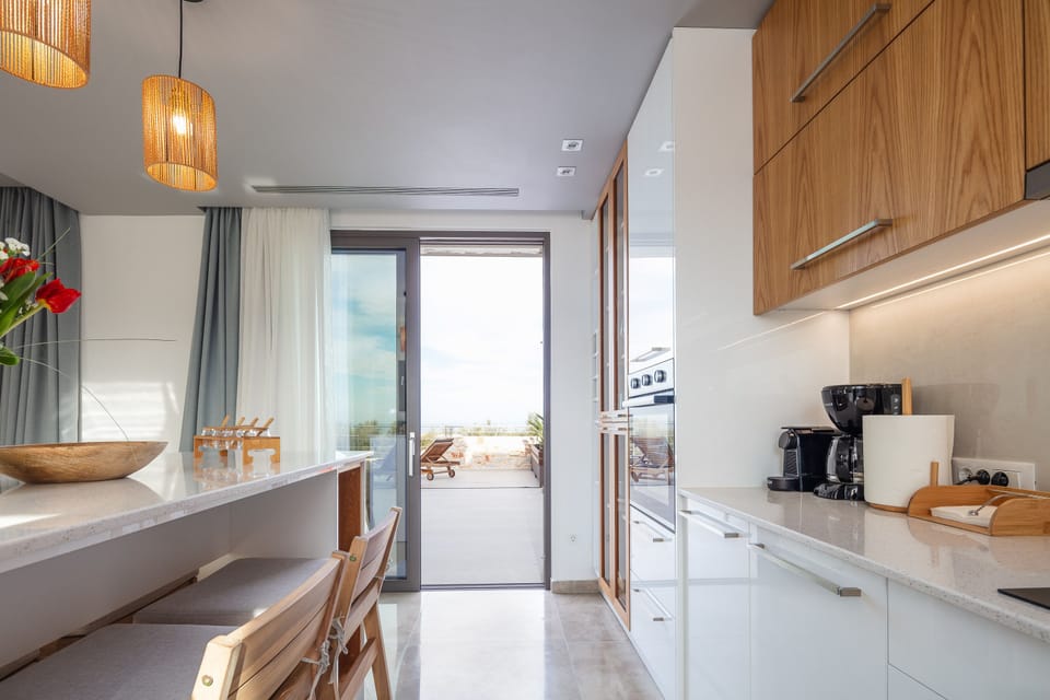 The kitchen opens up to the pool area.