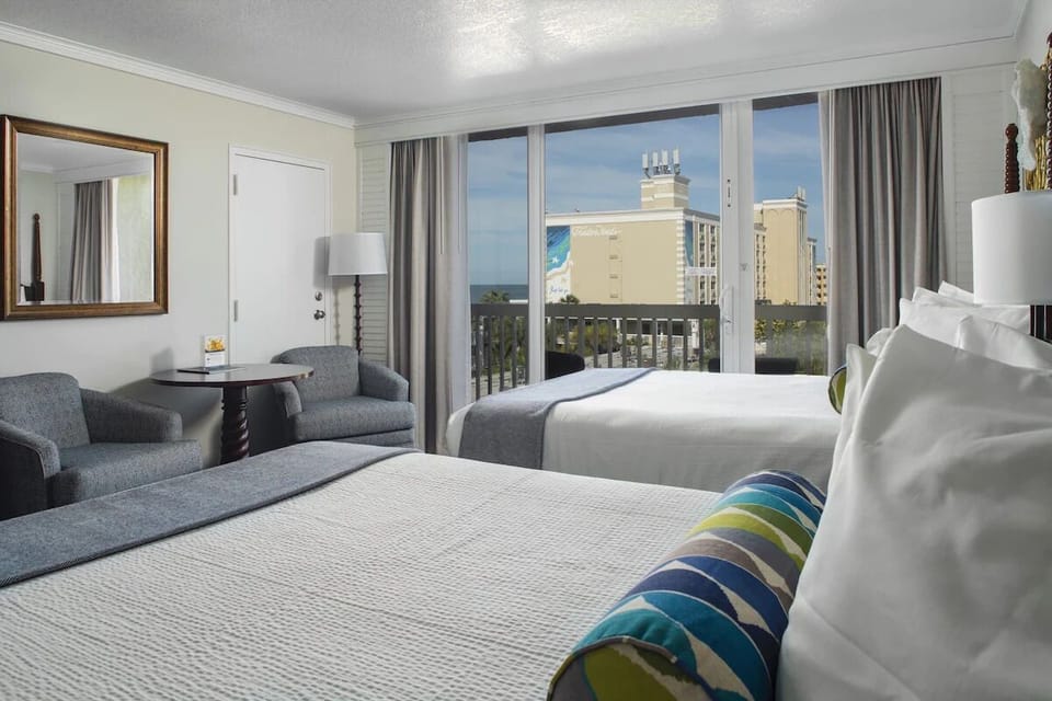 Wake up to coastal light spilling across your restful room.