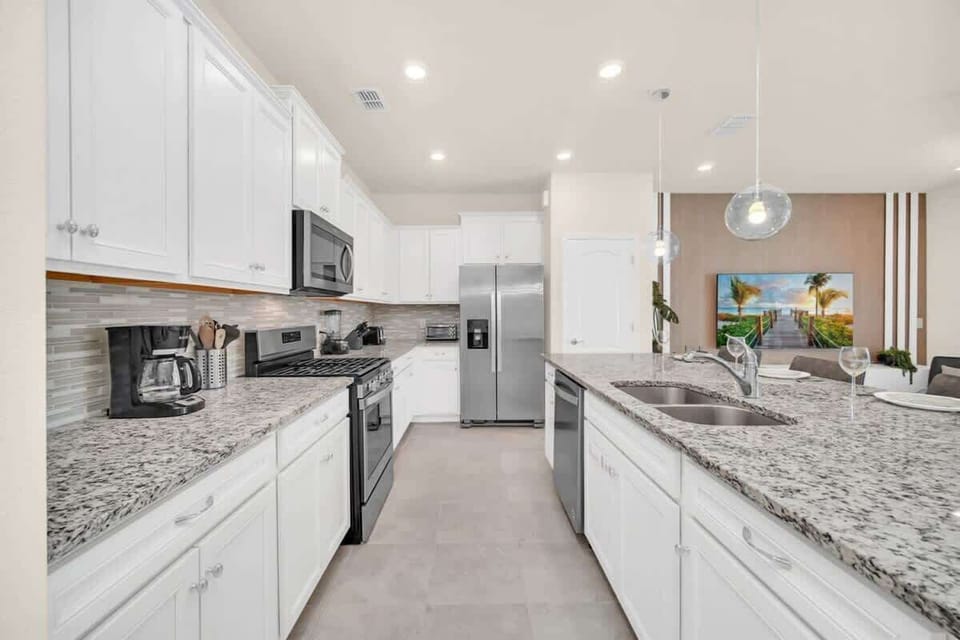Modern kitchen with granite countertops and stainless steel appliances