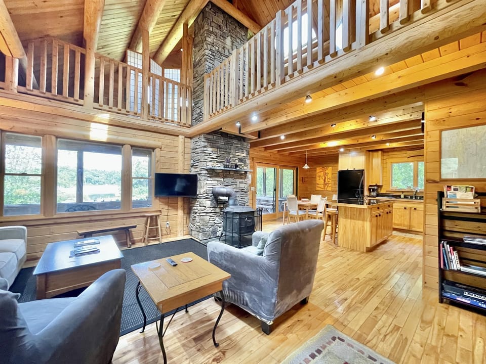 Living Area with Woof Stove, TV and Balcony