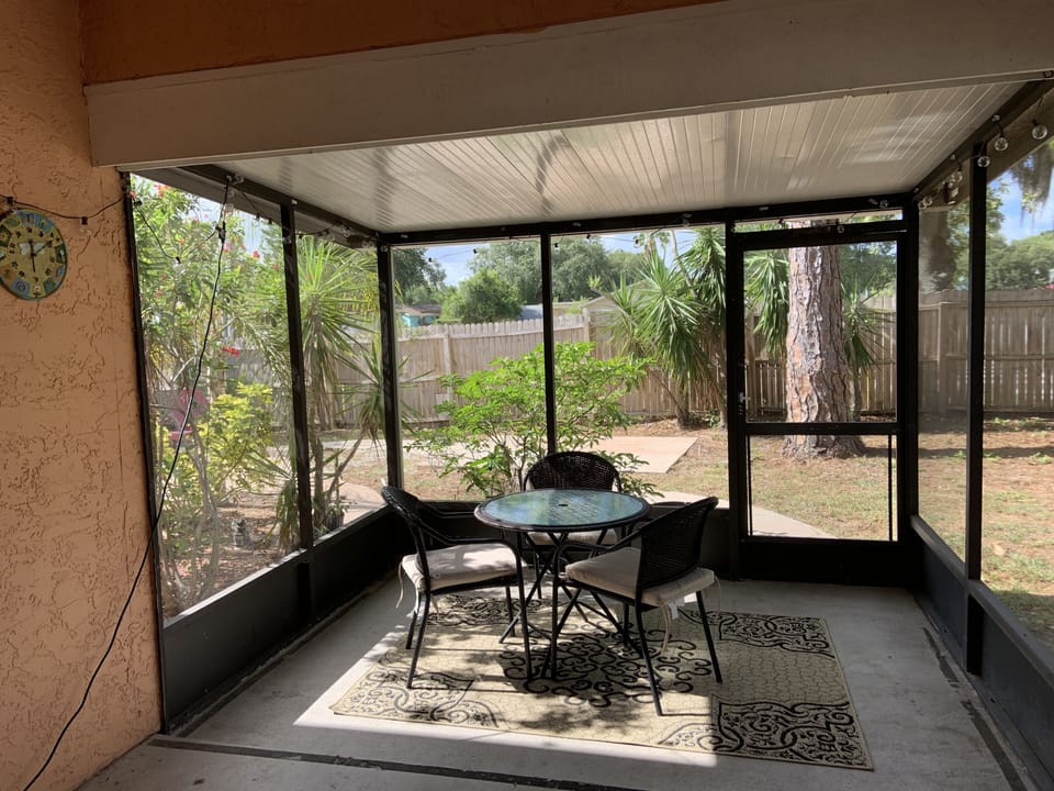 Outdoor patio with screened in porch to enjoy those cool Florida nights. 