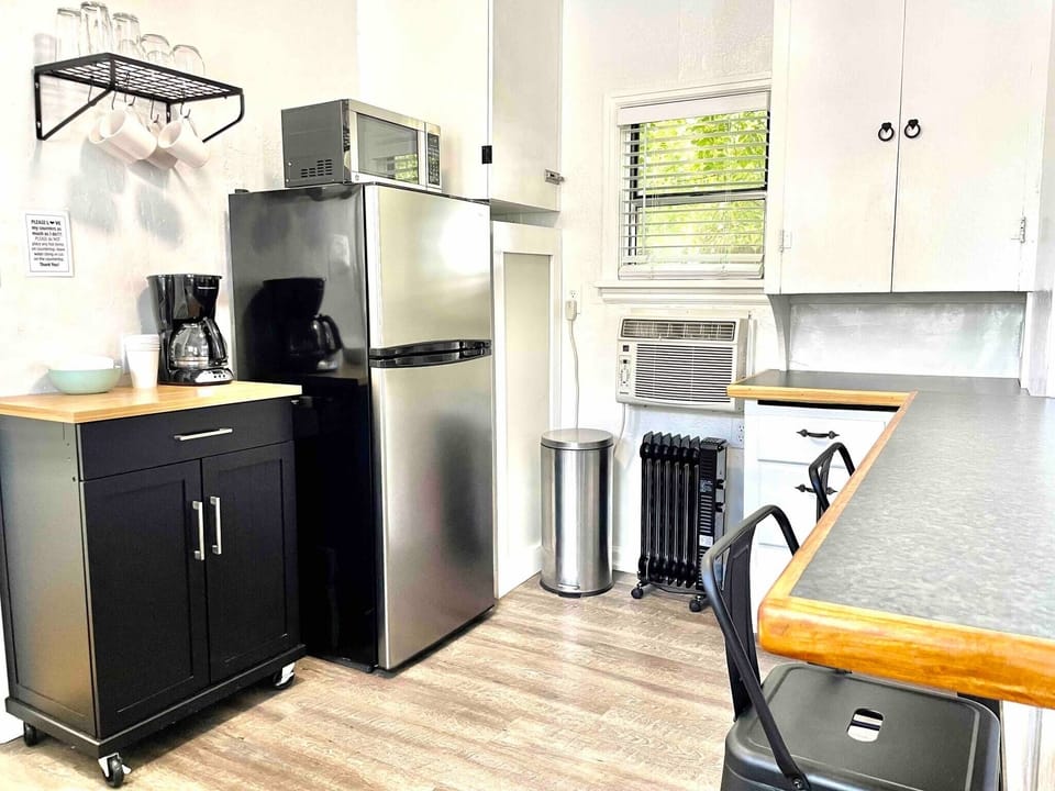 Wall air conditioner centrally located in unit and convenient when working from home at the counter space. Heaters in bedroom and bathroom with an extra portable heater available. 