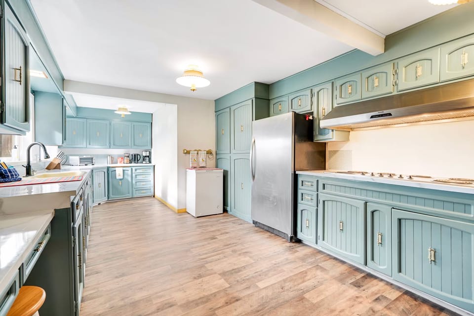 Large kitchen with plenty of pots/pans, microwave, toaster oven, toaster