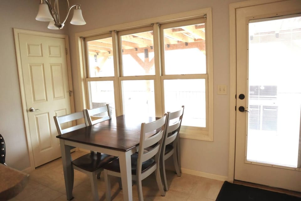 Dining area looking out over the back deck and hot tub area.