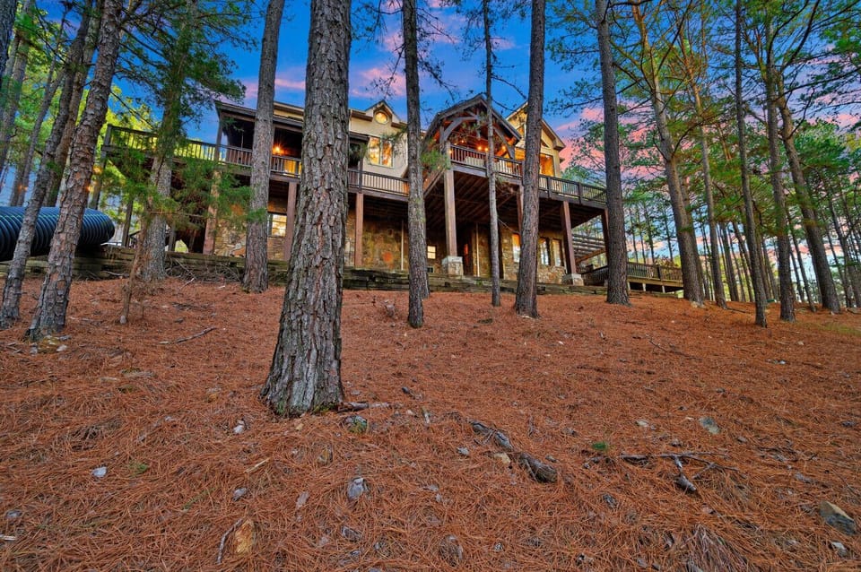 Nestled amidst towering pine trees, this quaint cabin offers a serene retreat in the heart of nature.