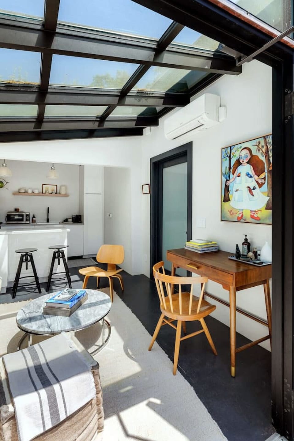 Relax in a well-lit living area with plush seating and a warm, welcoming feel.