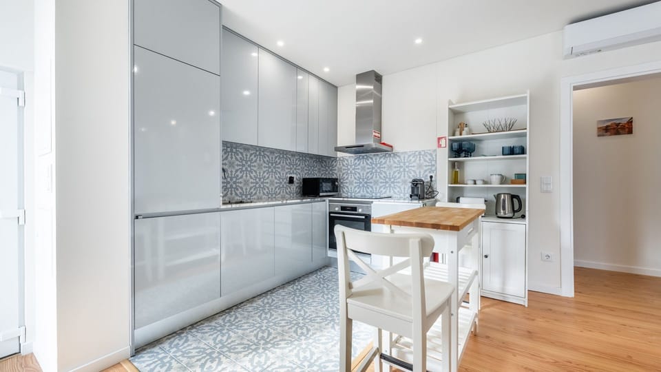 Sleek countertops and stylish cabinetry complement the functionality of our modern kitchenette #practical #stylish