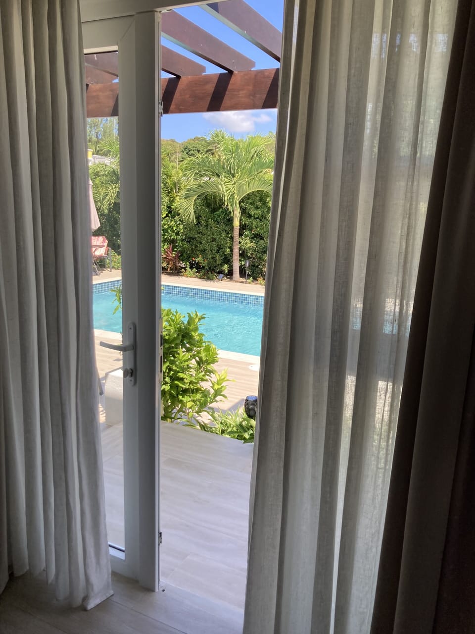 View to pool from Master Bedroom french window