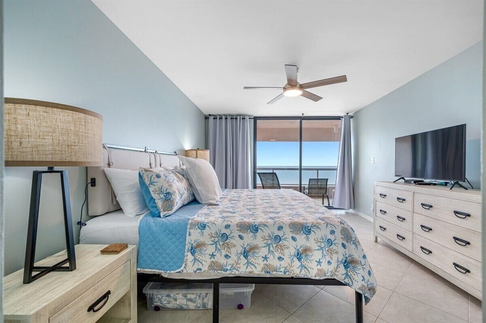 Spacious master bedroom with Gulf view and private balcony