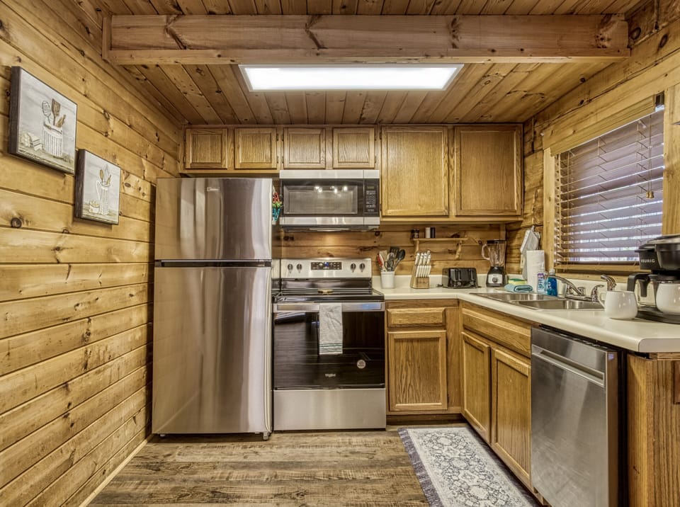 Kitchen. Well stocked with all pots,pans,utensils you need to cook it up!