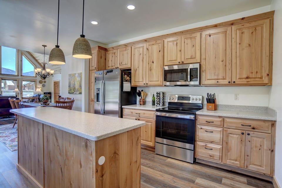 Kitchen - Mountain Aire VRC Rental Home - Our fully equipped kitchen with custom built Amish cabinets and electric range.