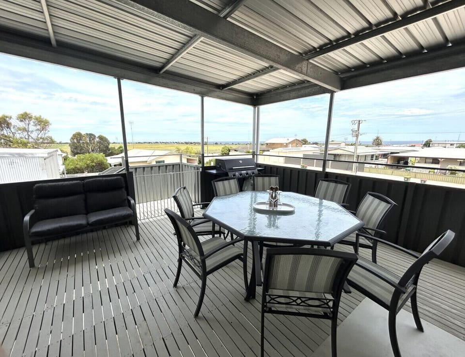 Outdoor Dining on Balcony with Sunset Views