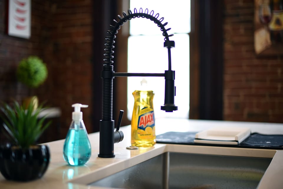 Clean & modern kitchen sink with handy essentials ready for you.