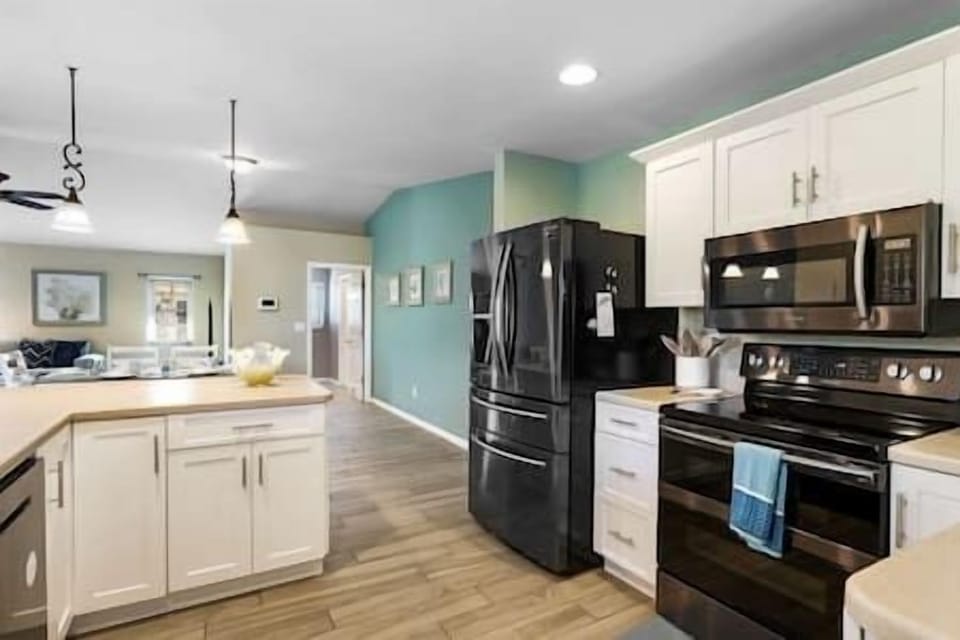 Well stocked kitchen with Black Stainless Samsung appliances.