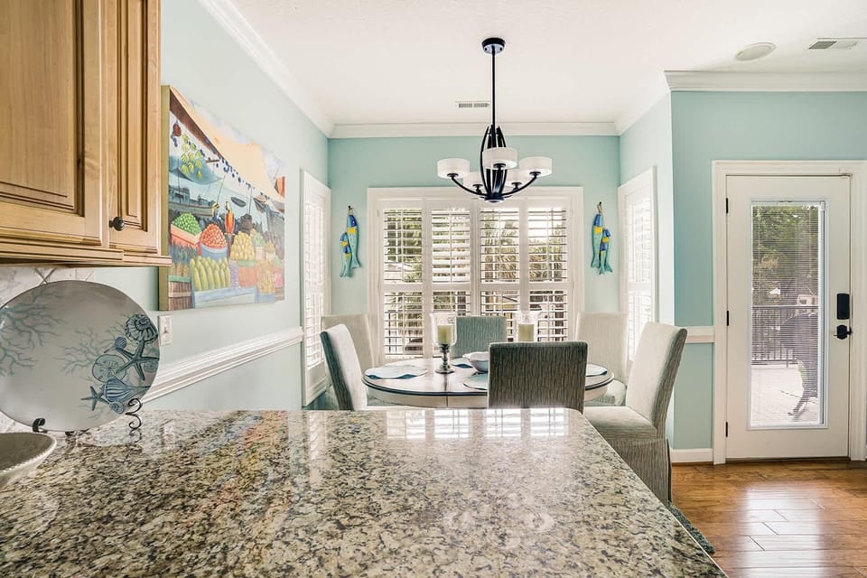 Bright dining area with cozy seating and garden views